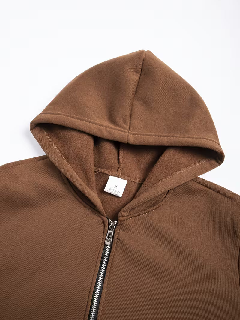 Ensemble deux pièces pour homme comprenant un sweat à capuche zippé à demi-zip avec doublure polaire et un pantalon polaire assorti.